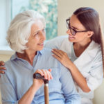 Kind one. Smiling senior woman with her home caregiver Kind one. Smiling senior woman with her home caregiver